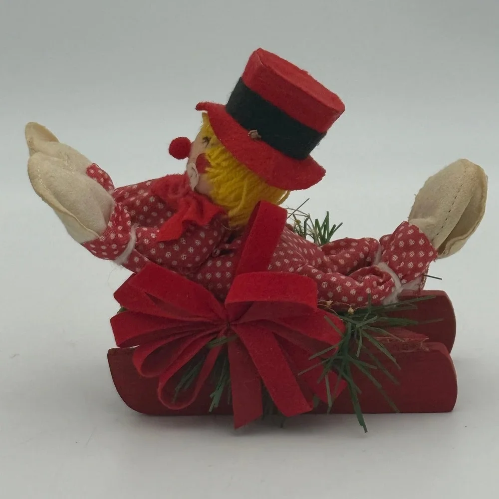 Vintage Christmas Clown on Red Wooden Sled Figurine Festive Holiday Decor 5 inch